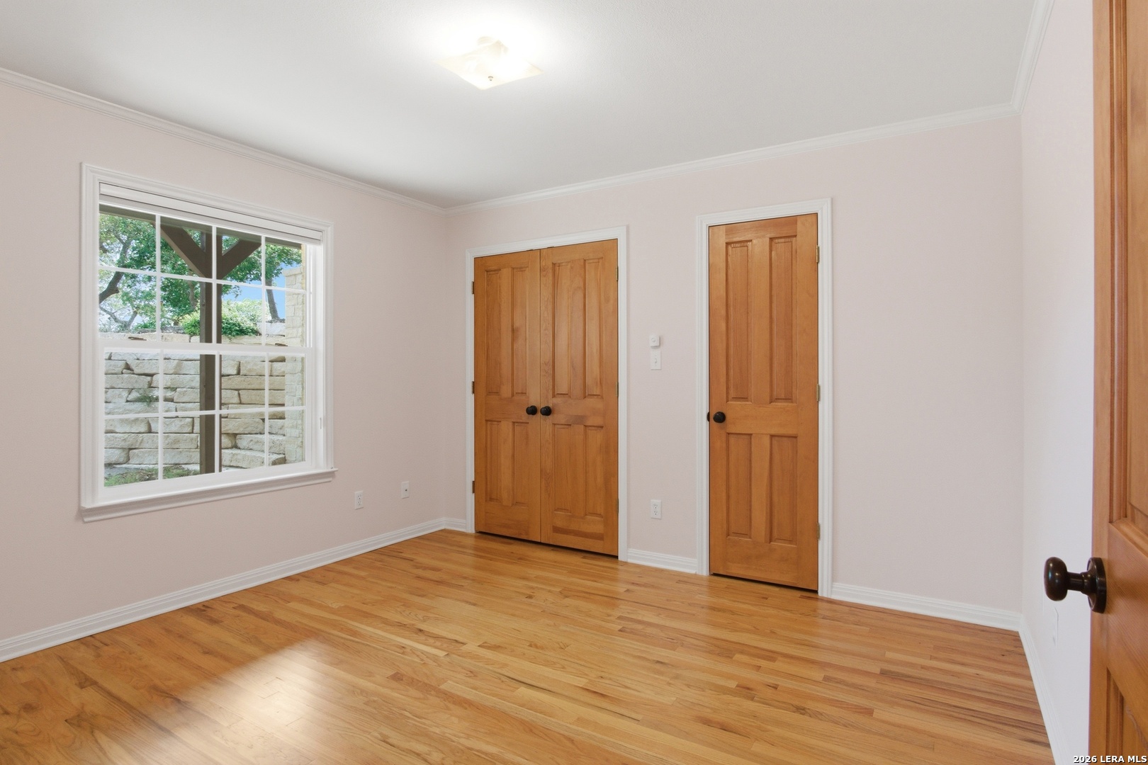 26 Seewald Road Boerne, TX 78006 - Photo 28 of 33 a view of an empty room with wooden floor and a window