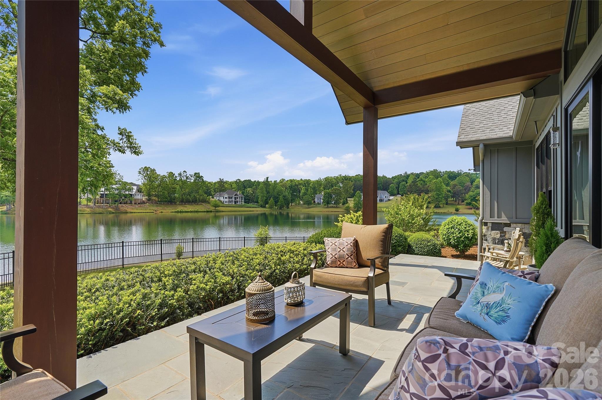 984 Mapleton Lane Tryon, NC 28782 - Photo 36 of 47 a view of a chairs and table in the patio next to a yard
