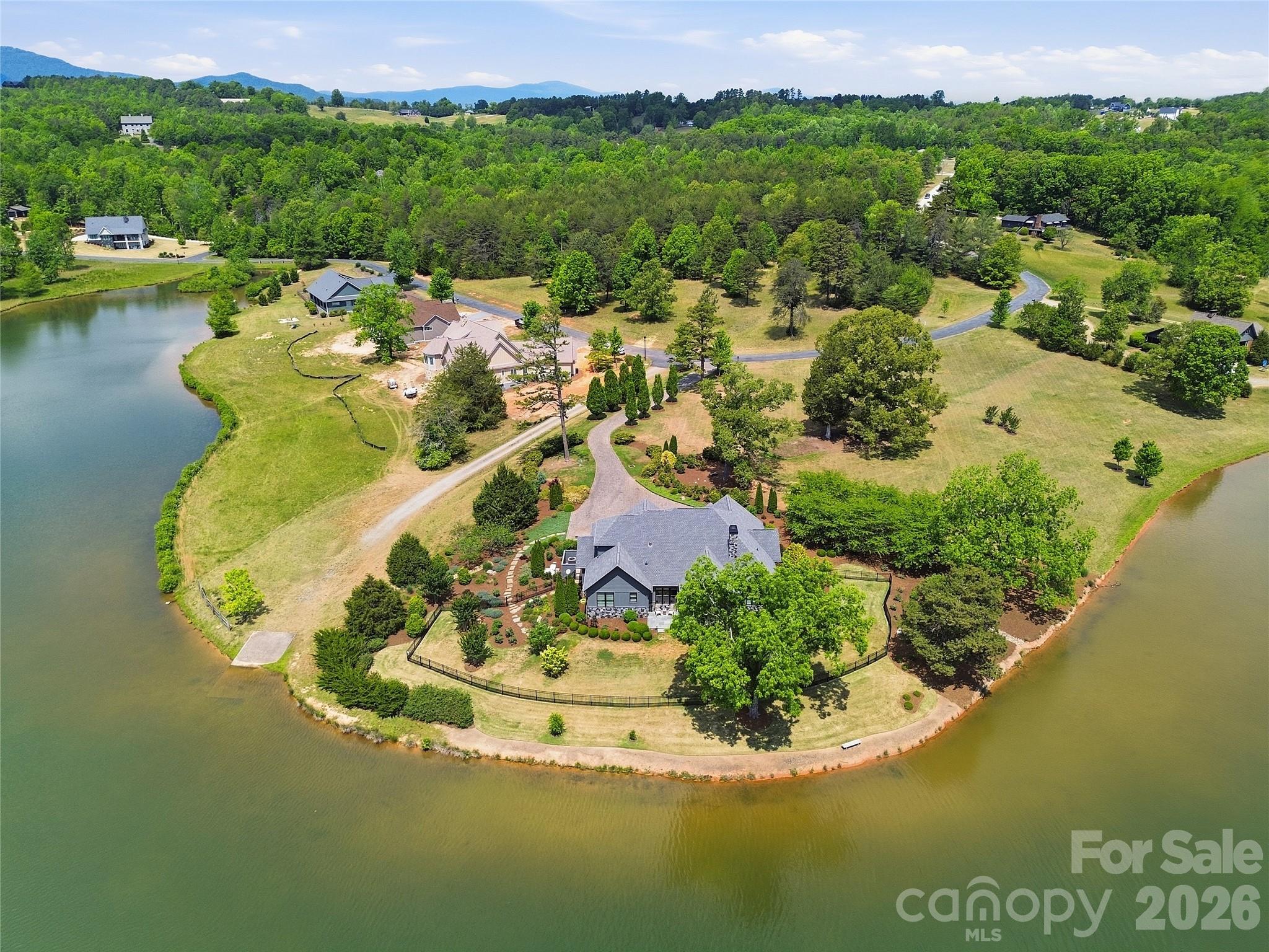 984 Mapleton Lane Tryon, NC 28782 - Photo 44 of 47 a view of a lake with a mountain