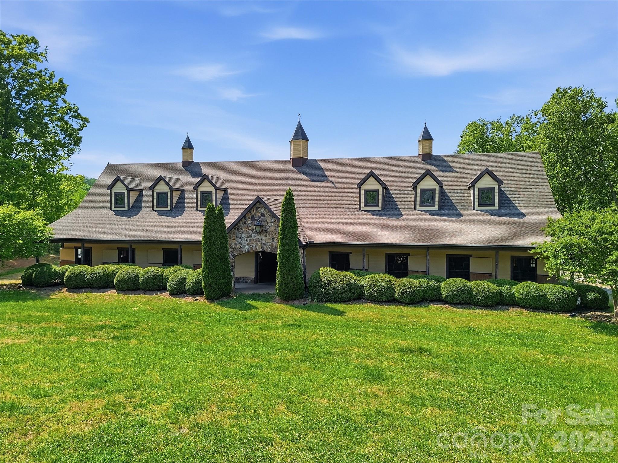 984 Mapleton Lane Tryon, NC 28782 - Photo 45 of 47 a view of a white house with a big yard and potted plants