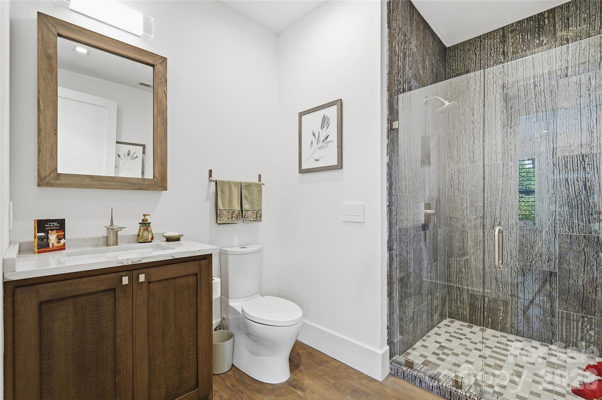 984 Mapleton Lane Tryon, NC 28782 - Photo 8 of 47 a bathroom with a sink a toilet and shower