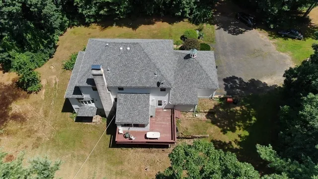 an aerial view of a house with a garden