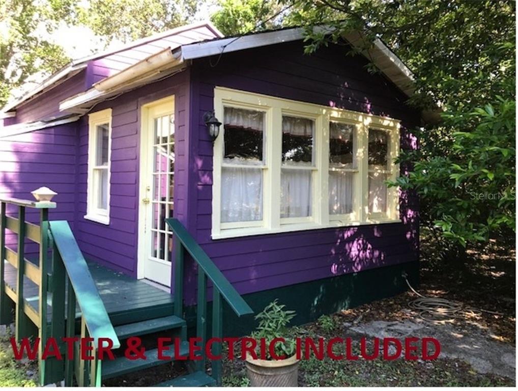 826 Howard Street, Unit B Clearwater, FL 33756 - Photo 1 of 1 a front view of a house with a yard