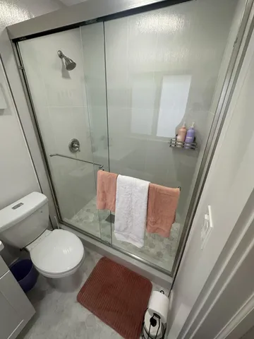 a bedroom with double bed and window