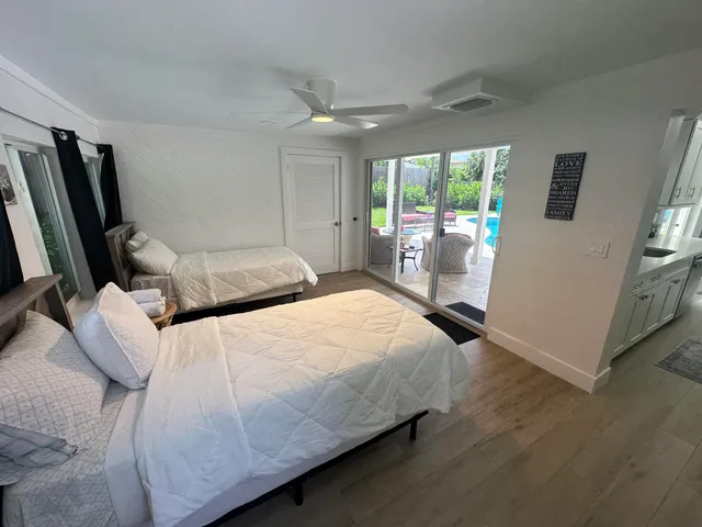 a backyard of a house with table and chairs
