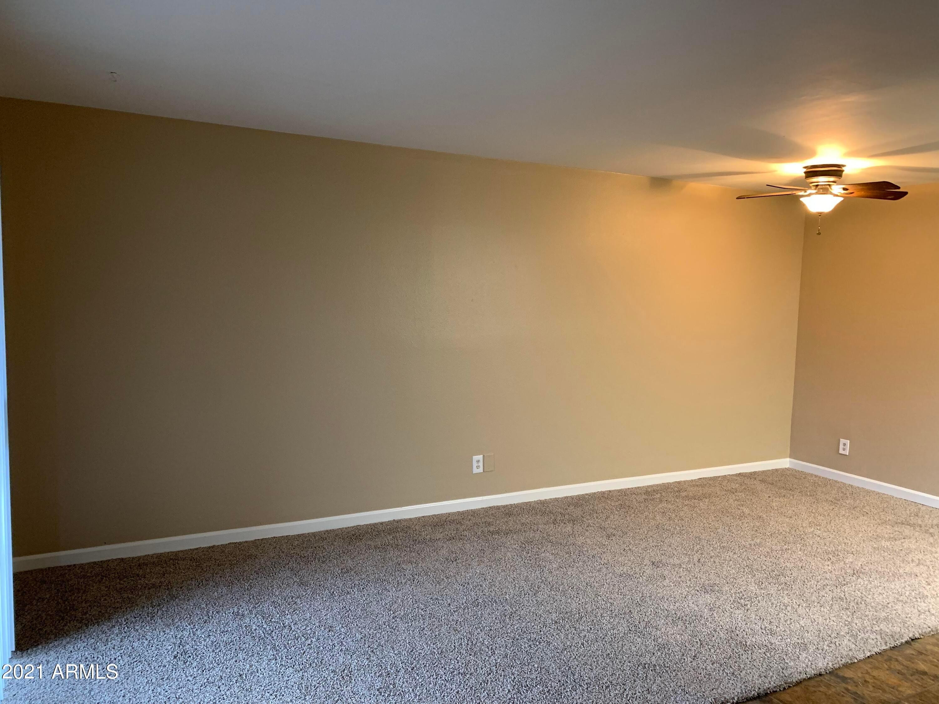 2217 East Cactus Road, Unit 4 Phoenix, AZ 85022 - Photo 10 of 14 a view of small space with empty racks
