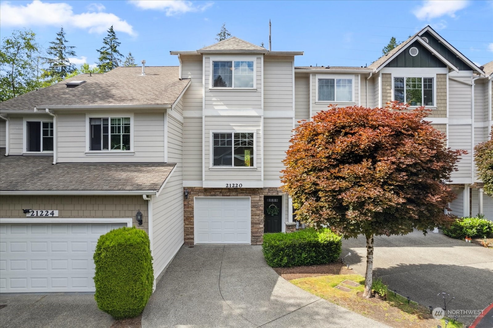 21220 11th Drive Southeast Bothell, WA 98021 - Photo 1 of 37 a front view of a house with a yard and garage