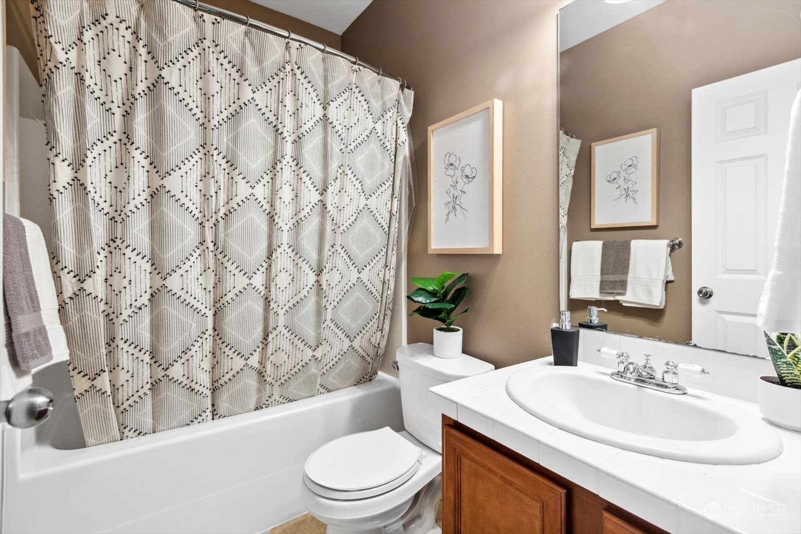 21220 11th Drive Southeast Bothell, WA 98021 - Photo 13 of 37 a bathroom with a sink a toilet and tub
