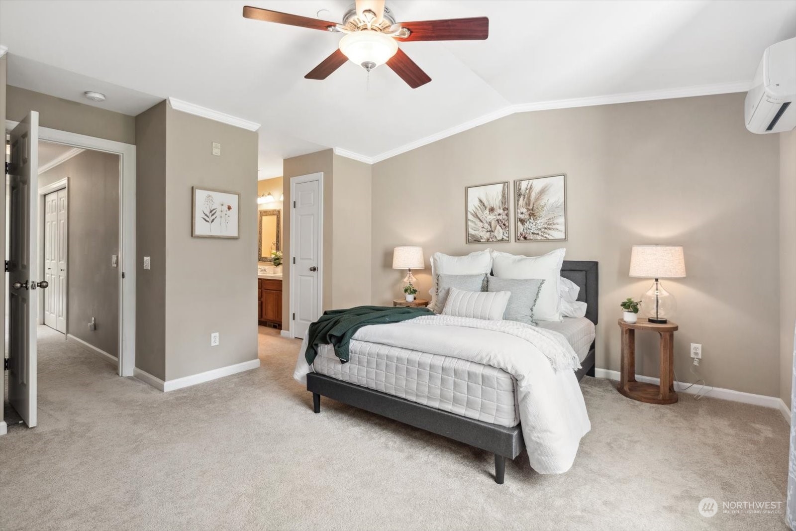 21220 11th Drive Southeast Bothell, WA 98021 - Photo 17 of 37 a spacious bedroom with a bed and a chandelier