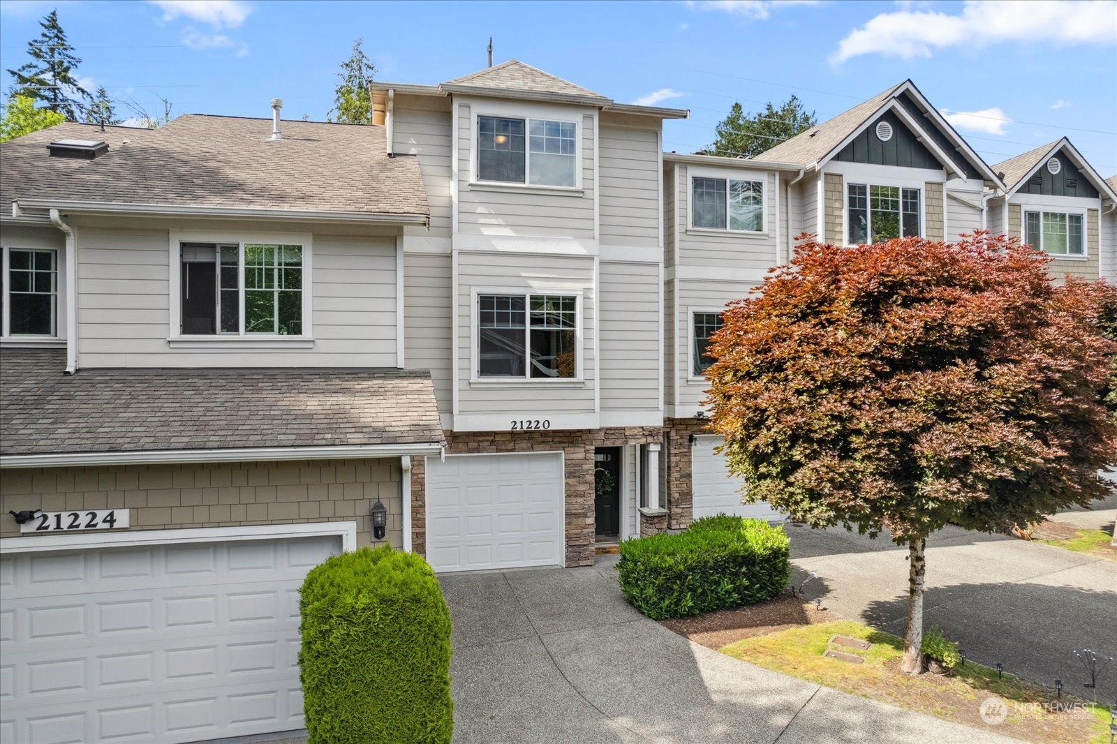 21220 11th Drive Southeast Bothell, WA 98021 - Photo 2 of 37 a front view of a house with a yard and garage