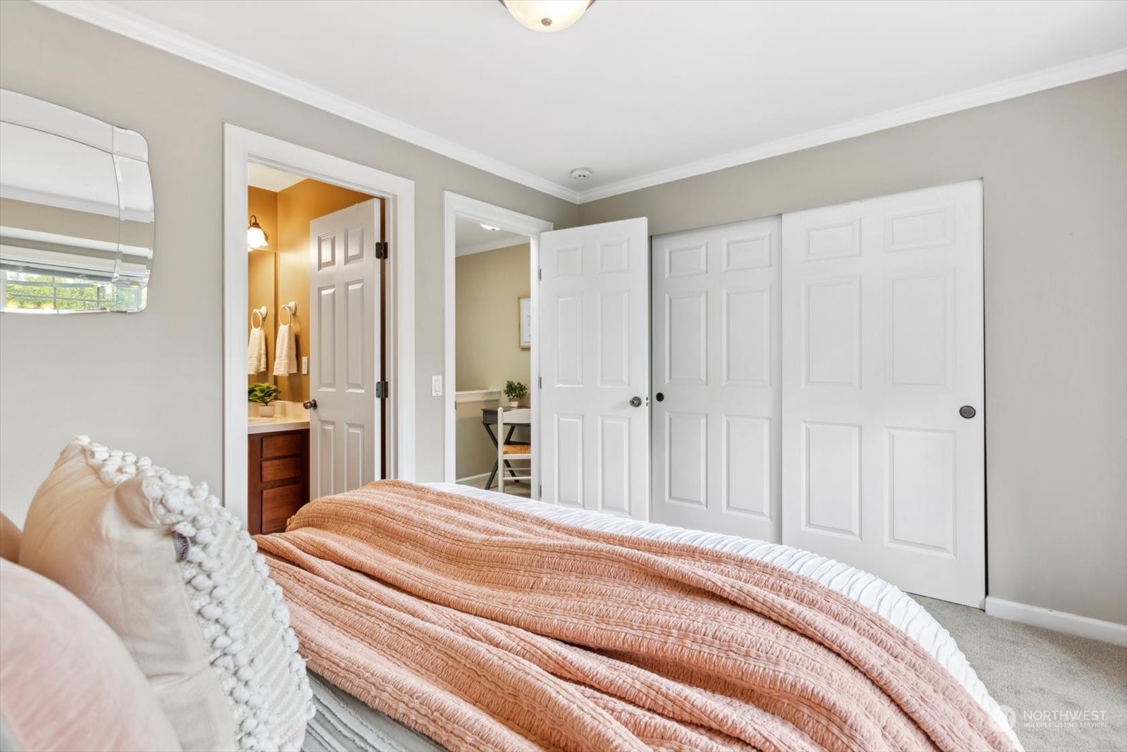 21220 11th Drive Southeast Bothell, WA 98021 - Photo 25 of 37 a bedroom with a large bed and a chandelier