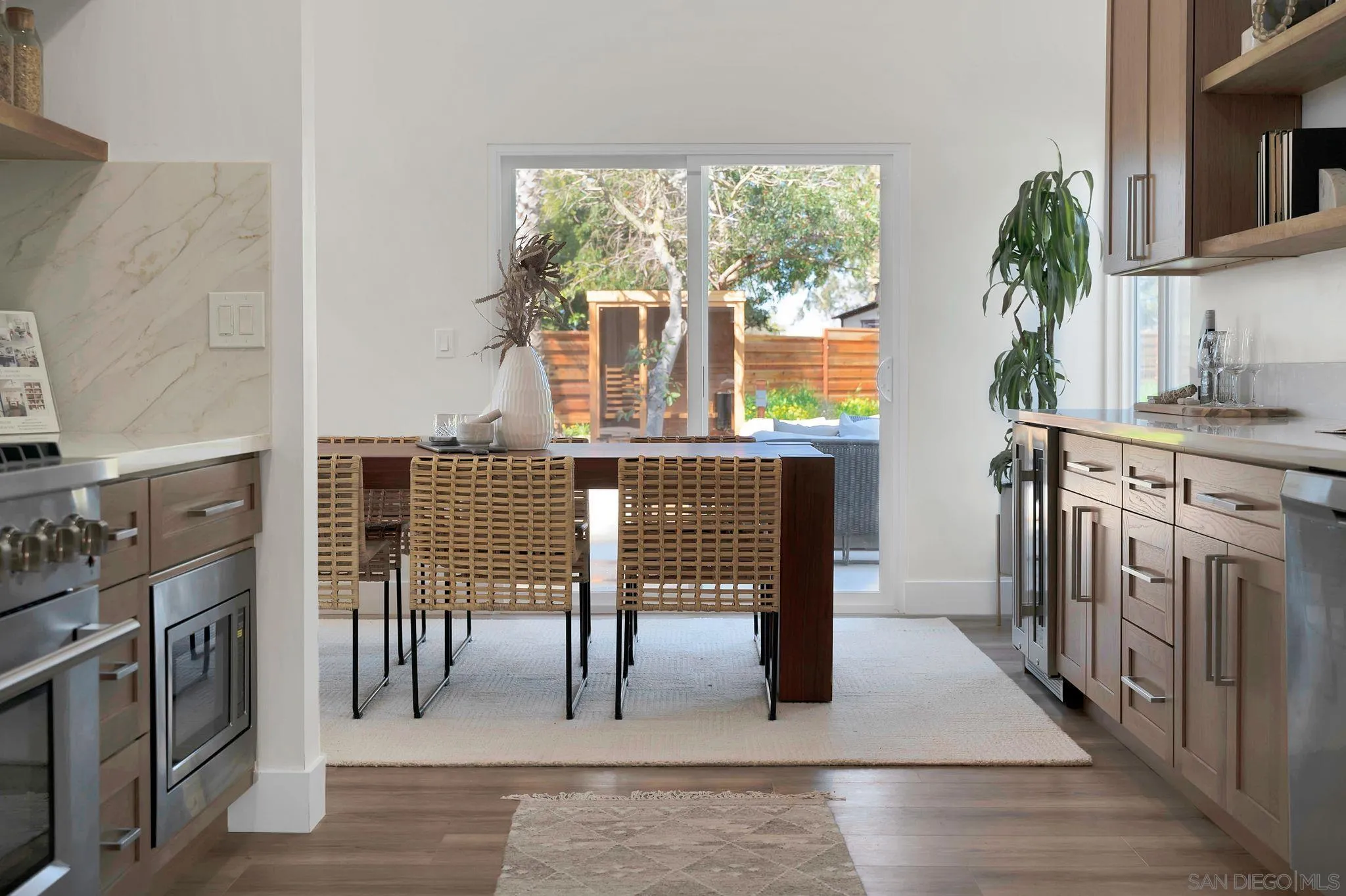 7815 Quebrada Circle Carlsbad, CA 92009 - Photo 14 of 32 a view of a kitchen with furniture and a fireplace