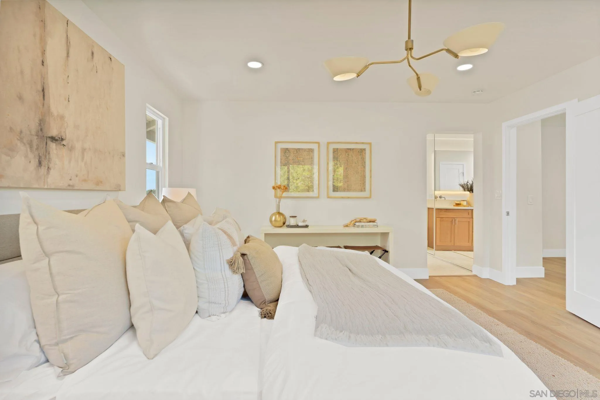 7815 Quebrada Circle Carlsbad, CA 92009 - Photo 19 of 32 a spacious bedroom with a bed and a couch