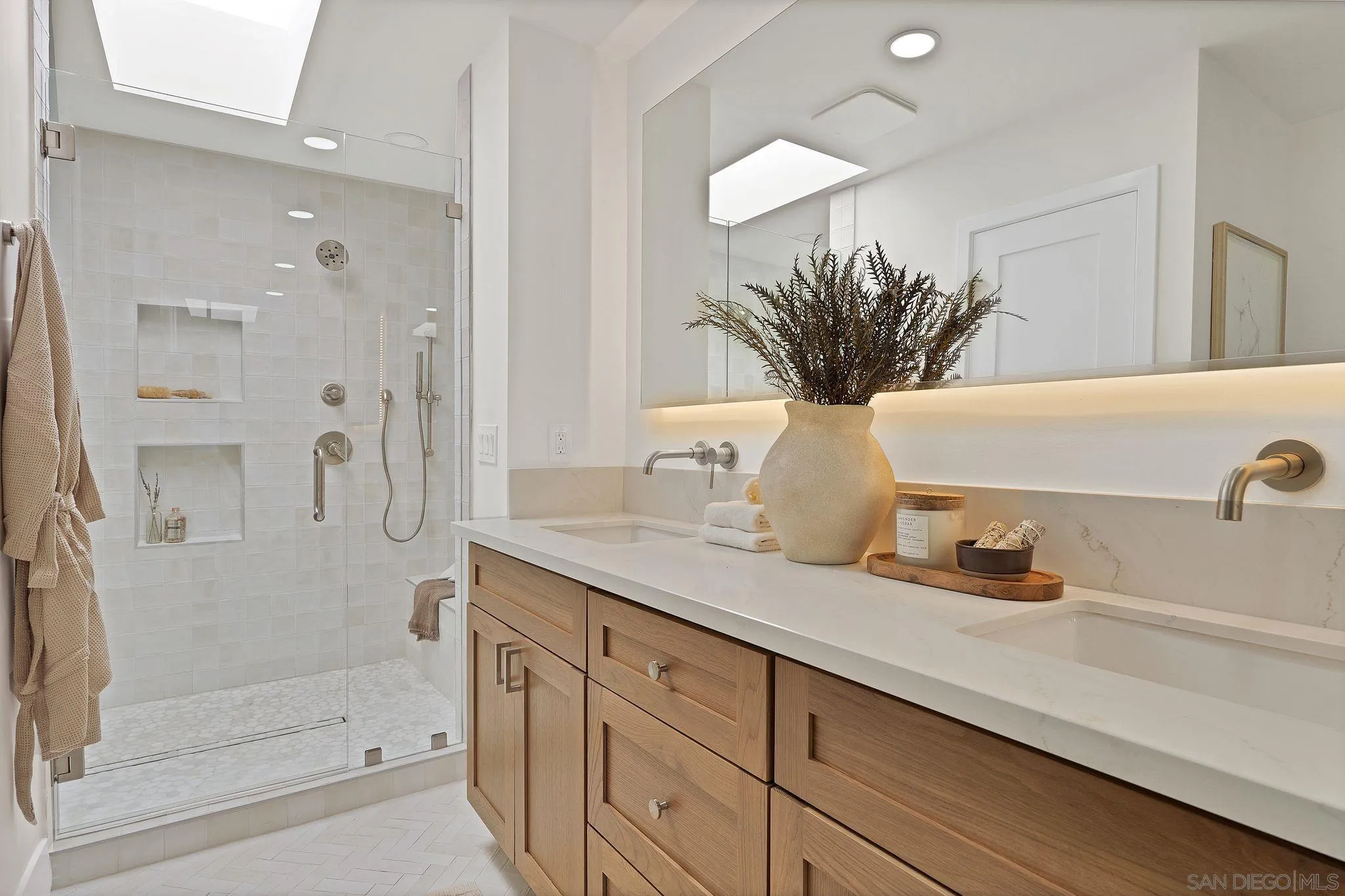 7815 Quebrada Circle Carlsbad, CA 92009 - Photo 21 of 32 a bathroom with a granite countertop sink a mirror and shower