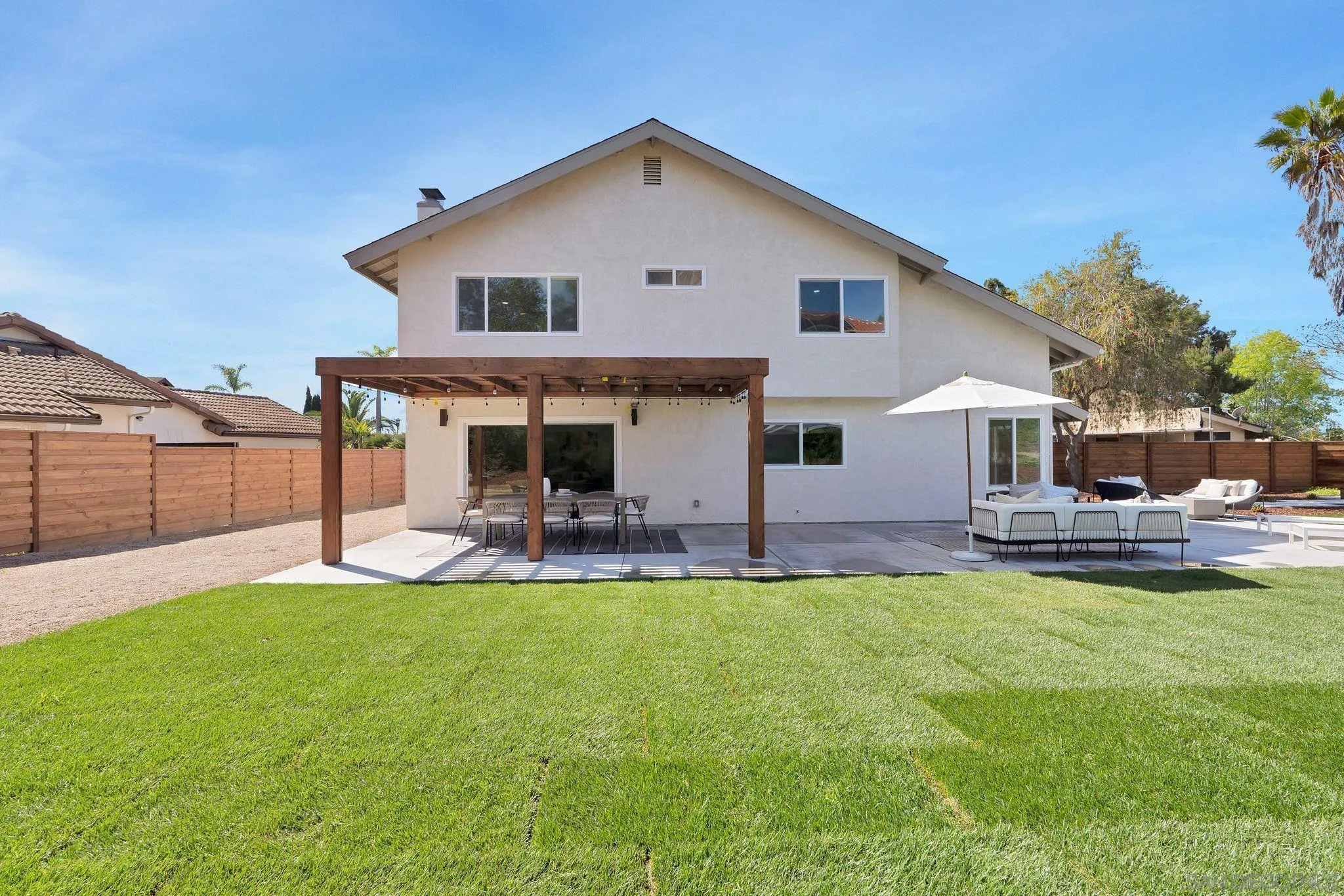 7815 Quebrada Circle Carlsbad, CA 92009 - Photo 24 of 32 a view of a house with a yard and sitting area