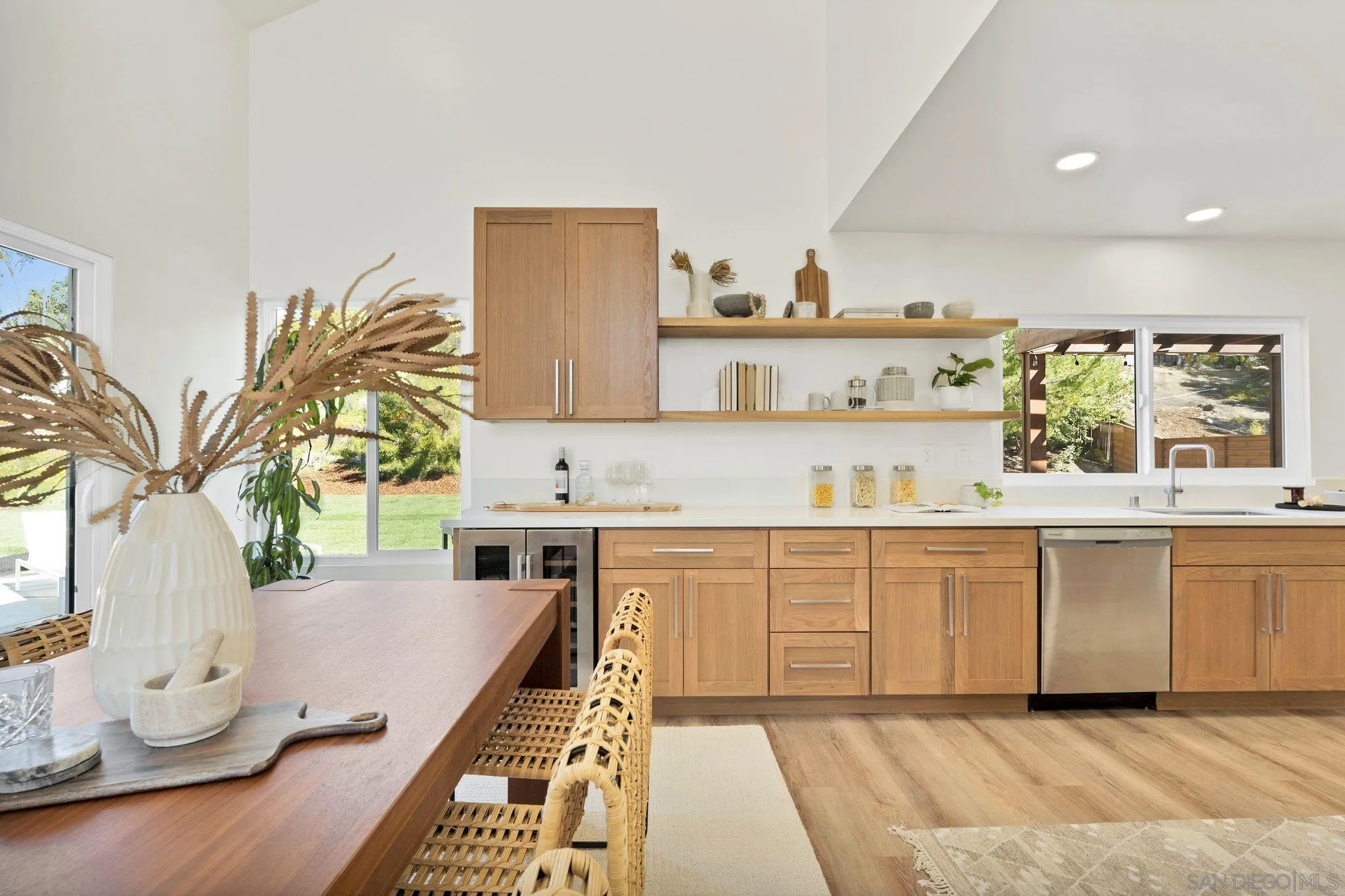 7815 Quebrada Circle Carlsbad, CA 92009 - Photo 9 of 32 a kitchen with a sink a stove and cabinets