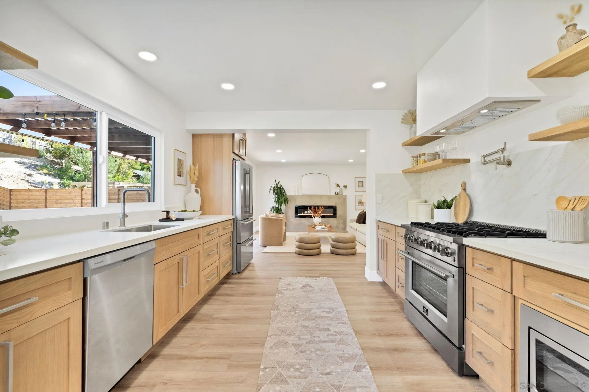 7815 Quebrada Circle Carlsbad, CA 92009 - Photo 10 of 32 a large kitchen with stainless steel appliances lots of counter space and a sink