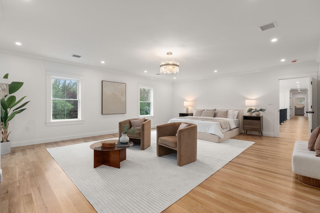 82 Deer Path Lane Weston, MA 02493 - Photo 17 of 42 a living room with furniture a large window and a wooden floor