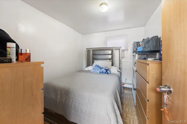 a bedroom with a bed and a television