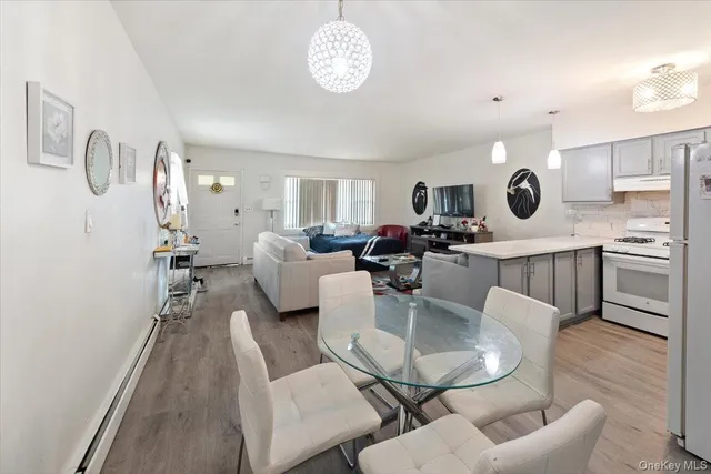a view of kitchen with dining table and chairs
