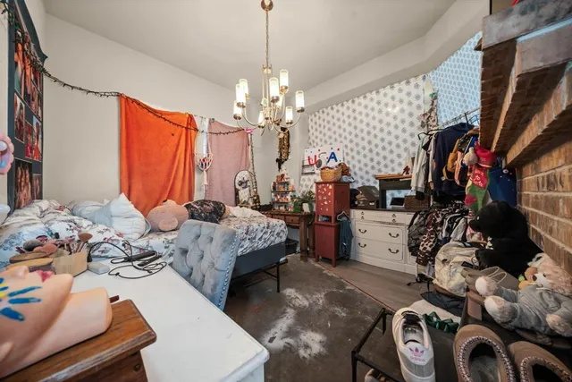 a bedroom with bed and a window