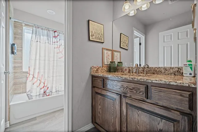 a bathroom with a toilet and a window