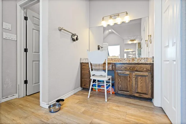 a view of a livingroom with furniture and a ceiling fan