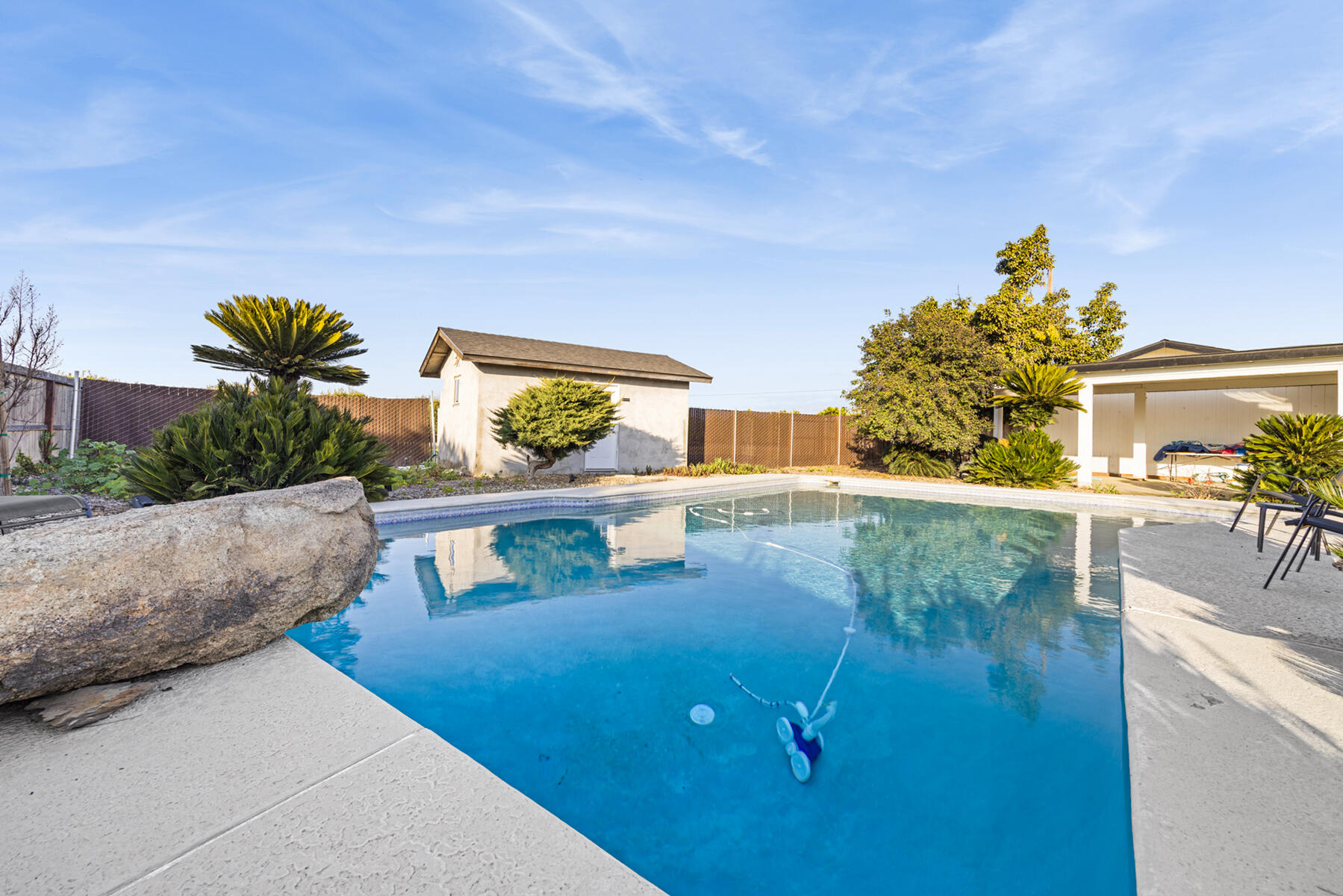 29205 Road 210 Exeter, CA 93221 - Photo 33 of 44 a view of a swimming pool with a yard