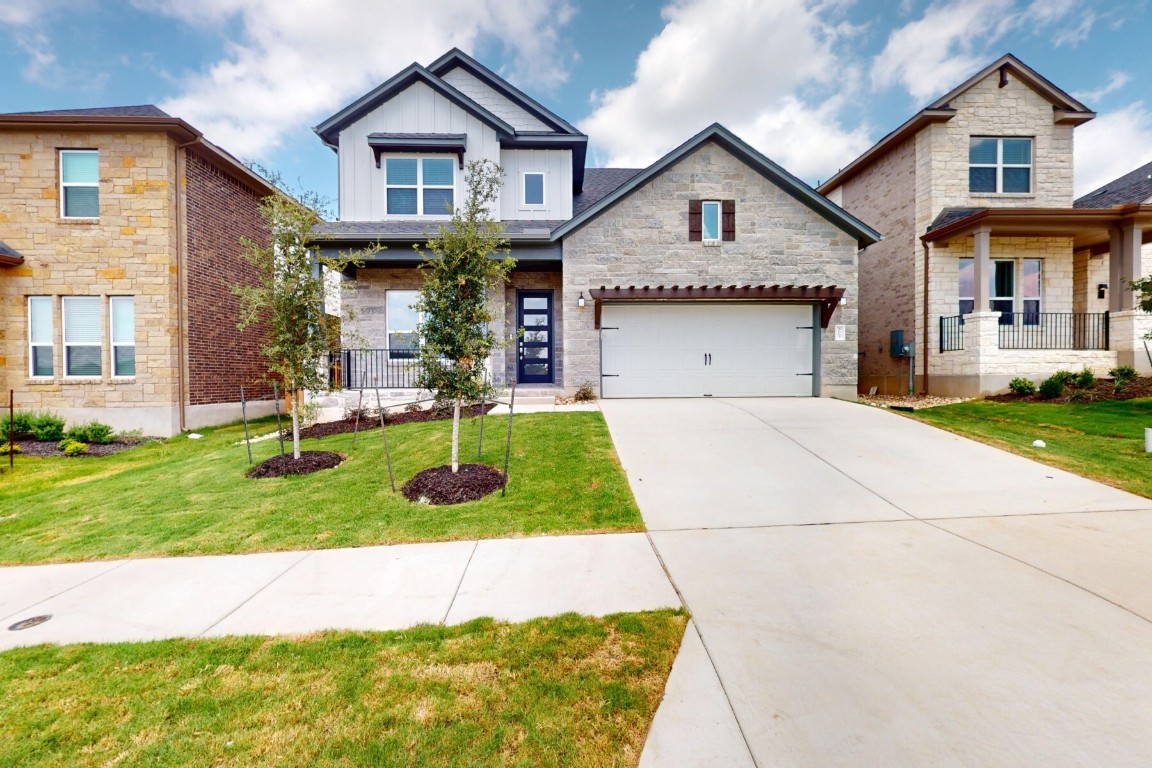 3663 Prosper Road Leander, TX 78641 - Photo 1 of 1 a front view of a house with a yard and garage
