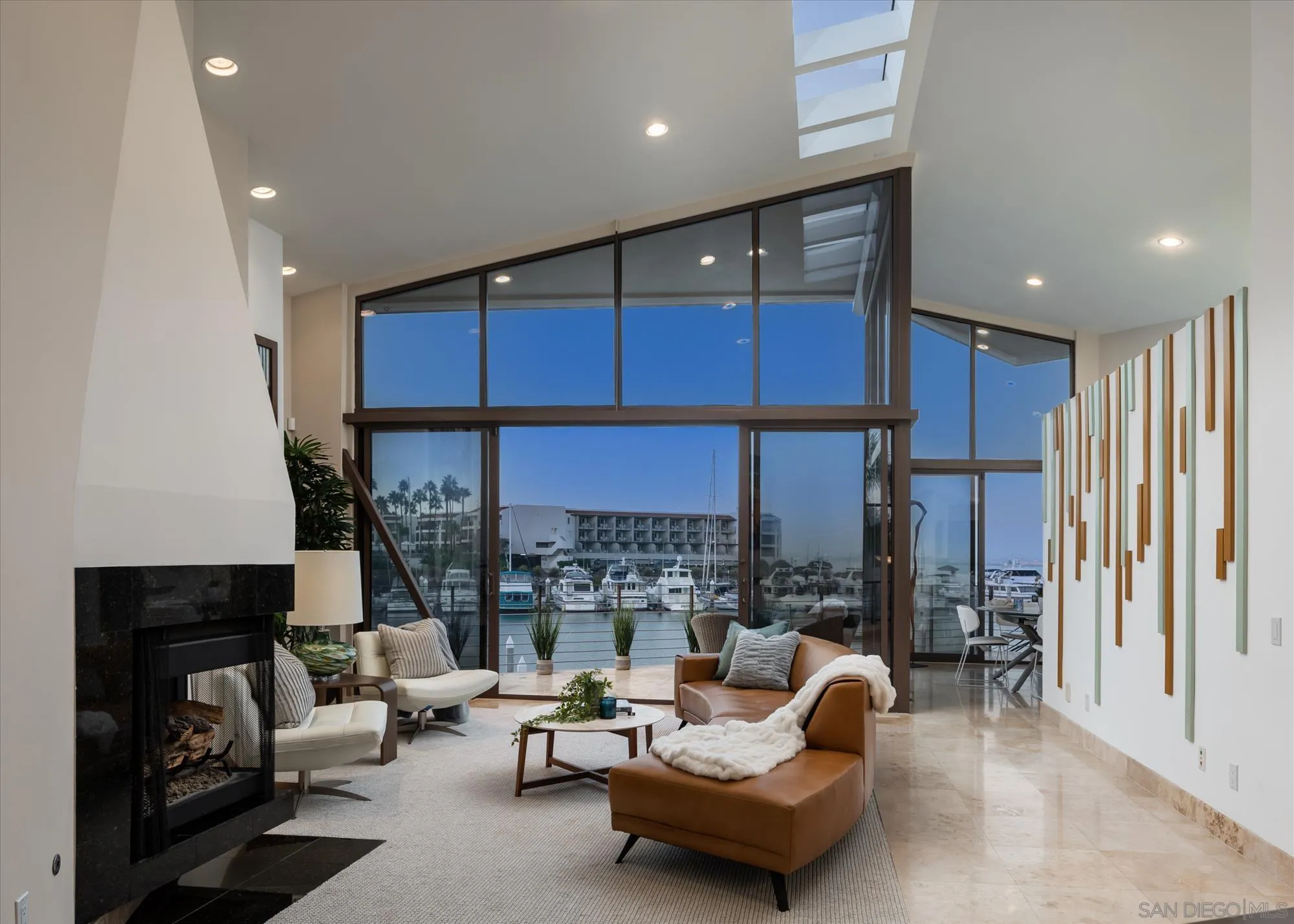 25 The Point Coronado, CA 92118 - Photo 12 of 52 a living room with furniture and a large window