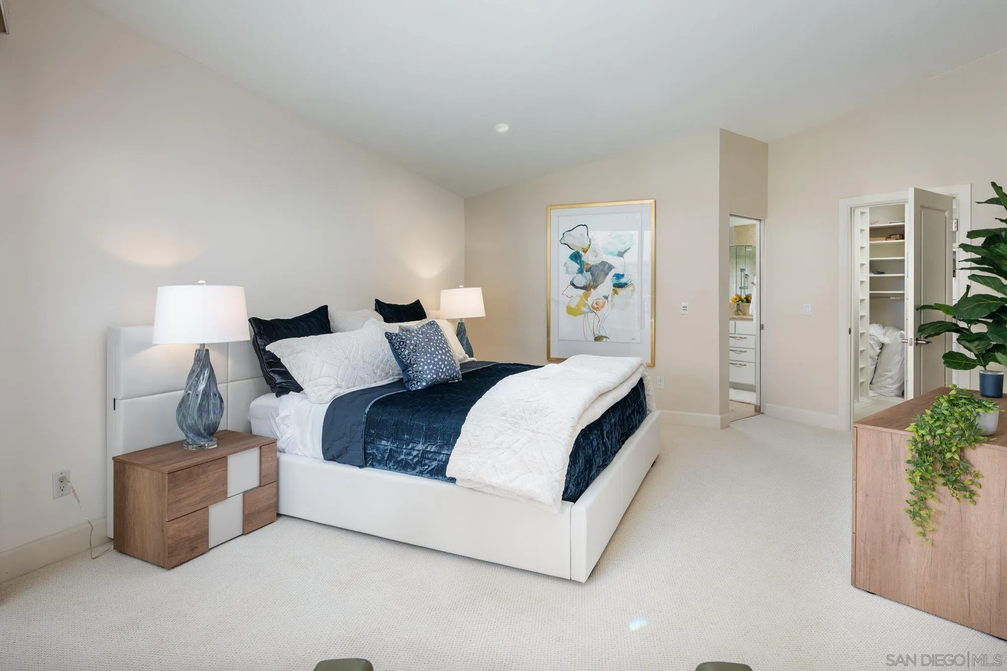 25 The Point Coronado, CA 92118 - Photo 22 of 52 a bedroom with bed and a night stand