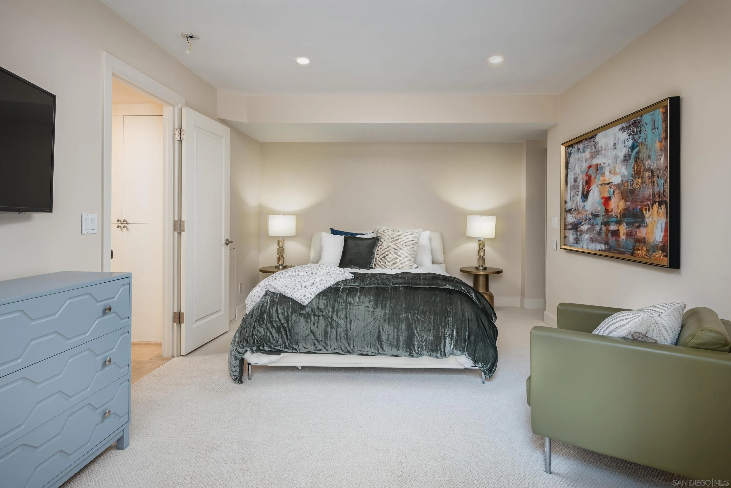 25 The Point Coronado, CA 92118 - Photo 29 of 52 a bedroom with a bed and a couch