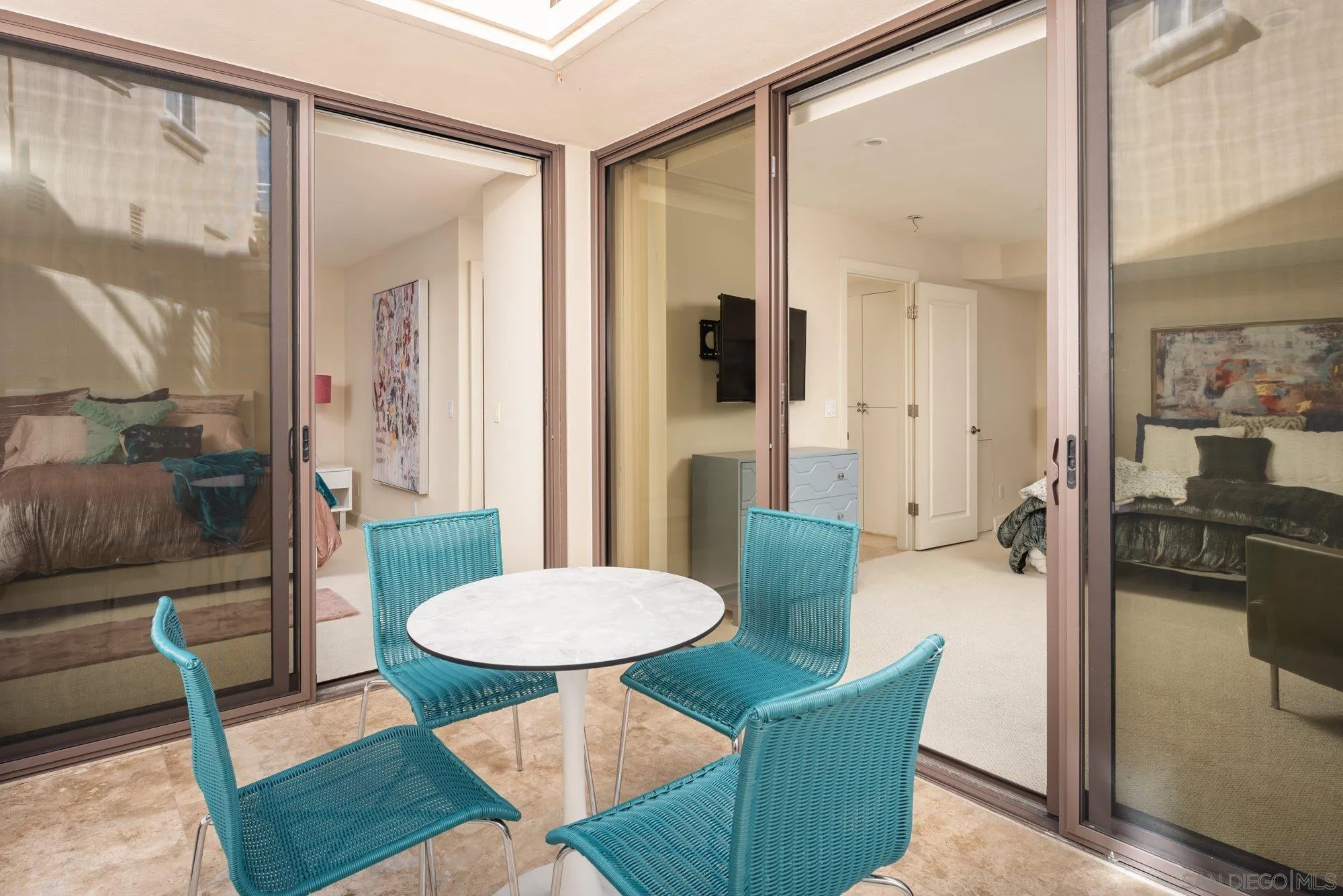 25 The Point Coronado, CA 92118 - Photo 30 of 52 a living room with furniture and a glass door