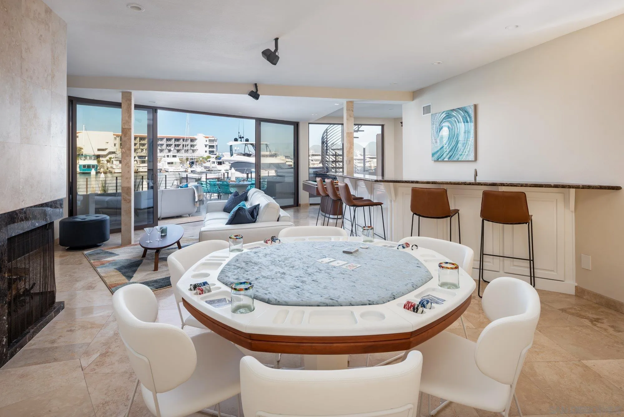 25 The Point Coronado, CA 92118 - Photo 31 of 52 a dining room with furniture a large window and wooden floor