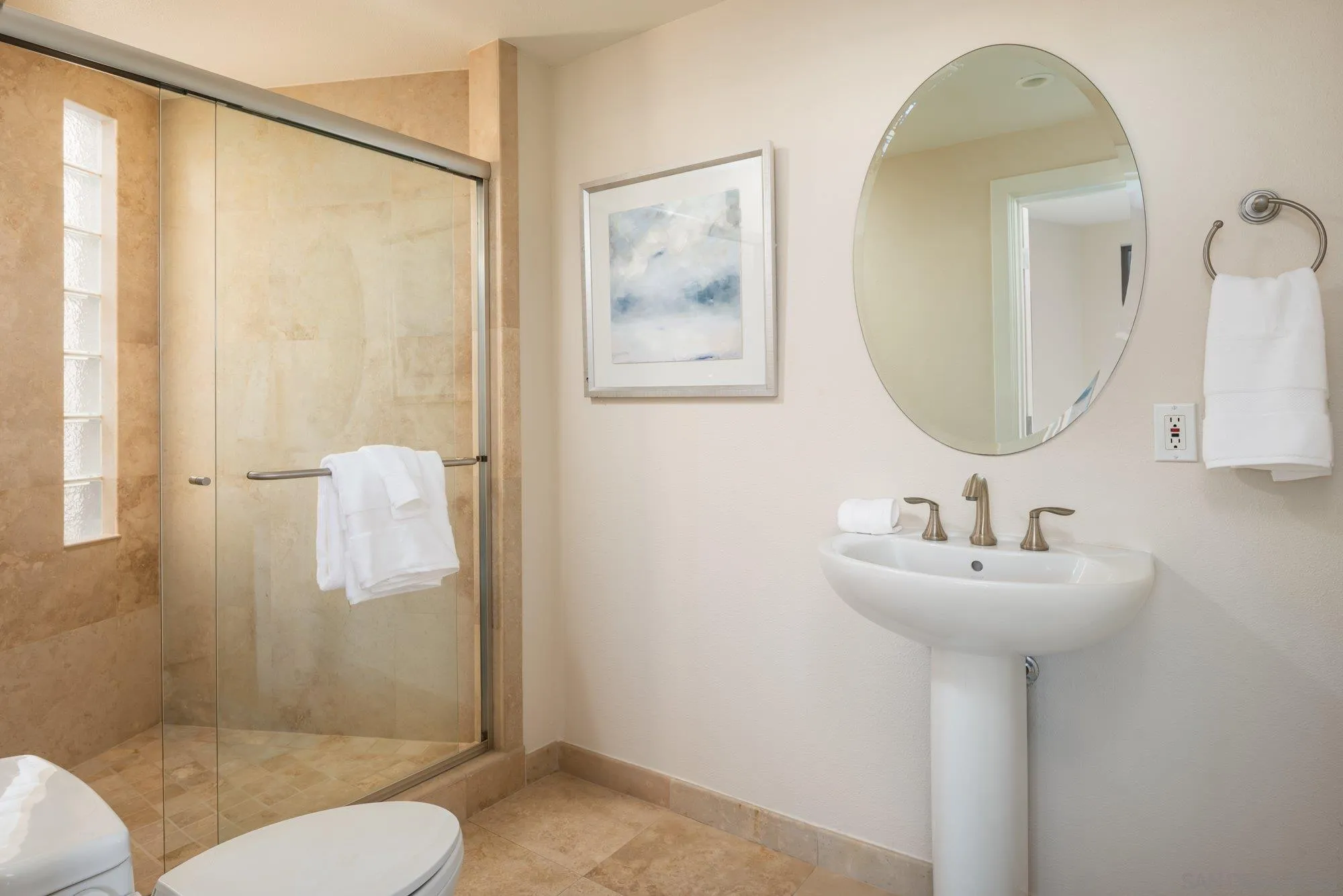 25 The Point Coronado, CA 92118 - Photo 36 of 52 a bathroom with a sink mirror toilet and shower