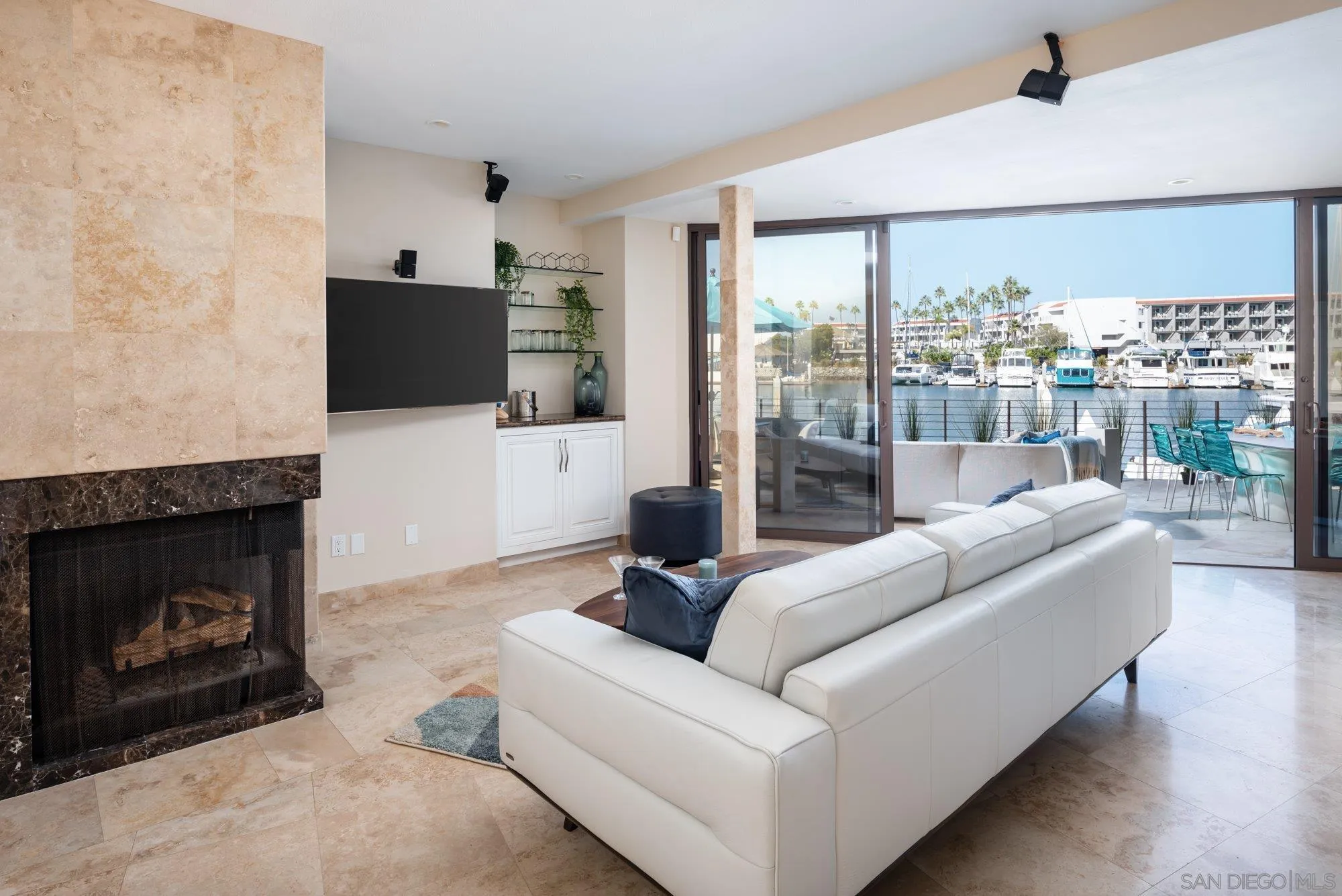 25 The Point Coronado, CA 92118 - Photo 38 of 52 a living room with furniture a flat screen tv and a fireplace