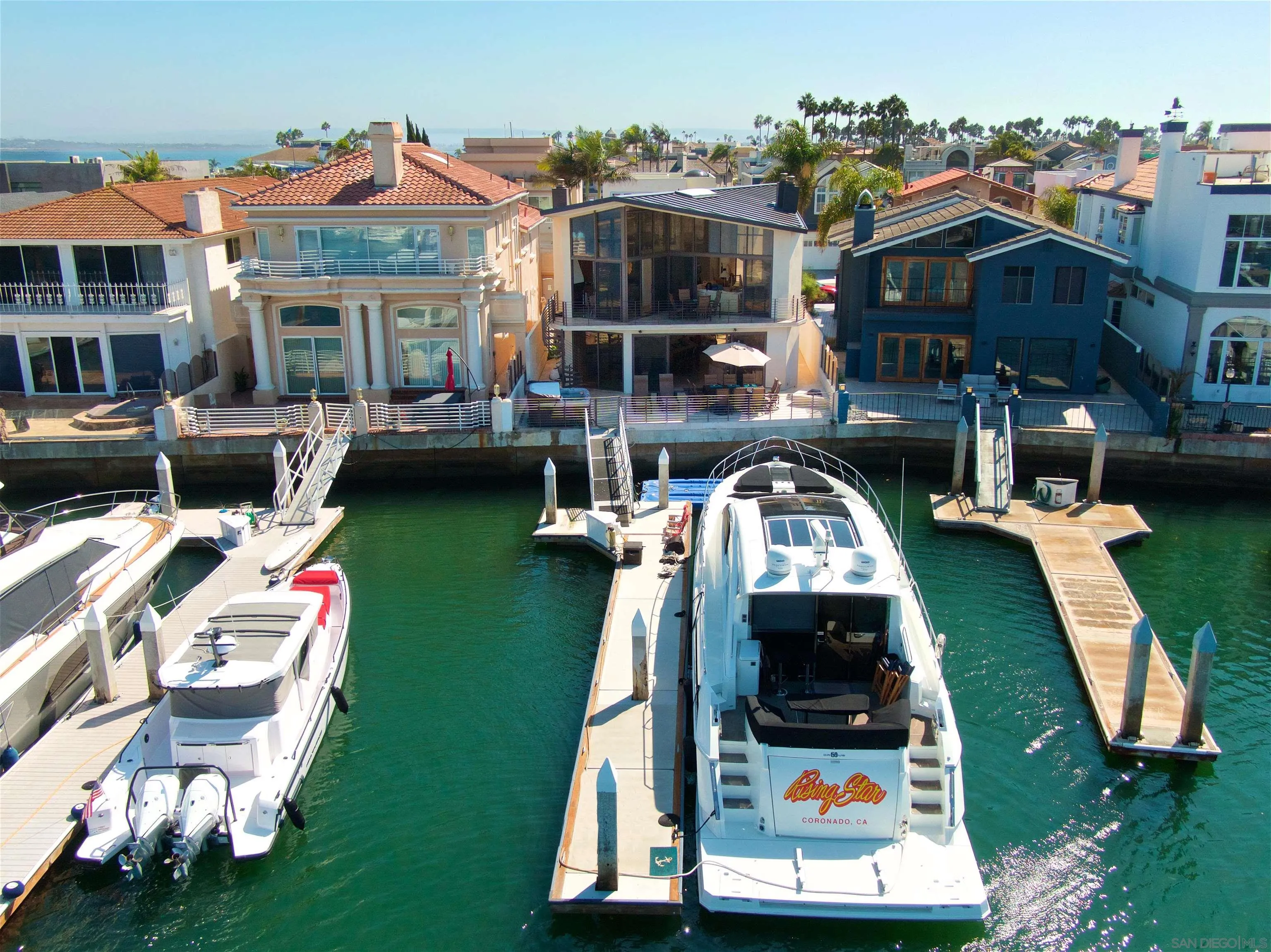 25 The Point Coronado, CA 92118 - Photo 44 of 52 an aerial view of a house with swimming pool garden view and a fire pit