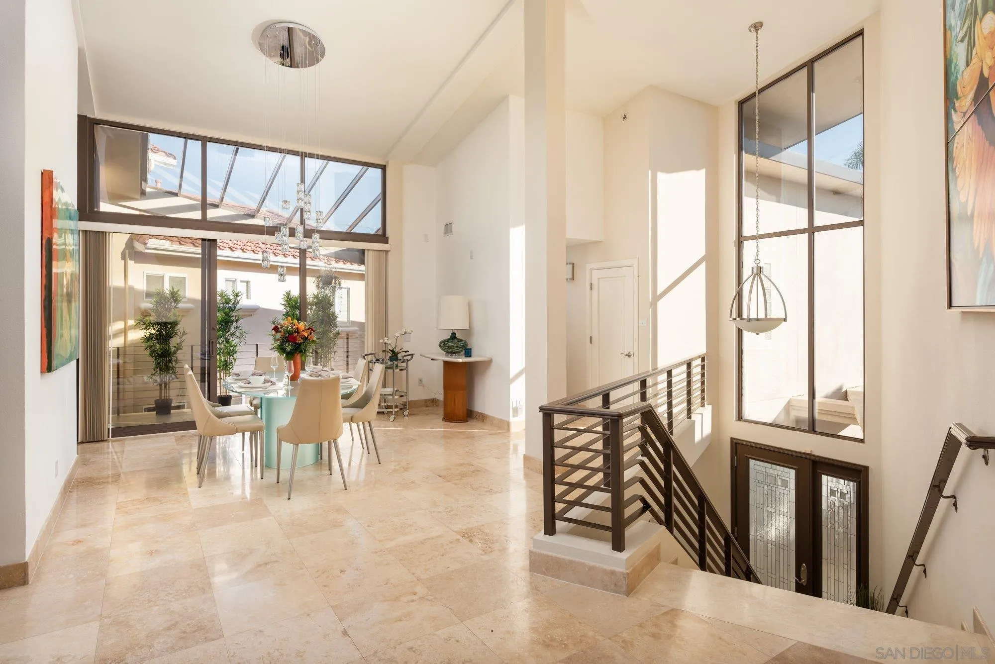25 The Point Coronado, CA 92118 - Photo 6 of 52 a view of a dining room with furniture wooden floor and a chandelier