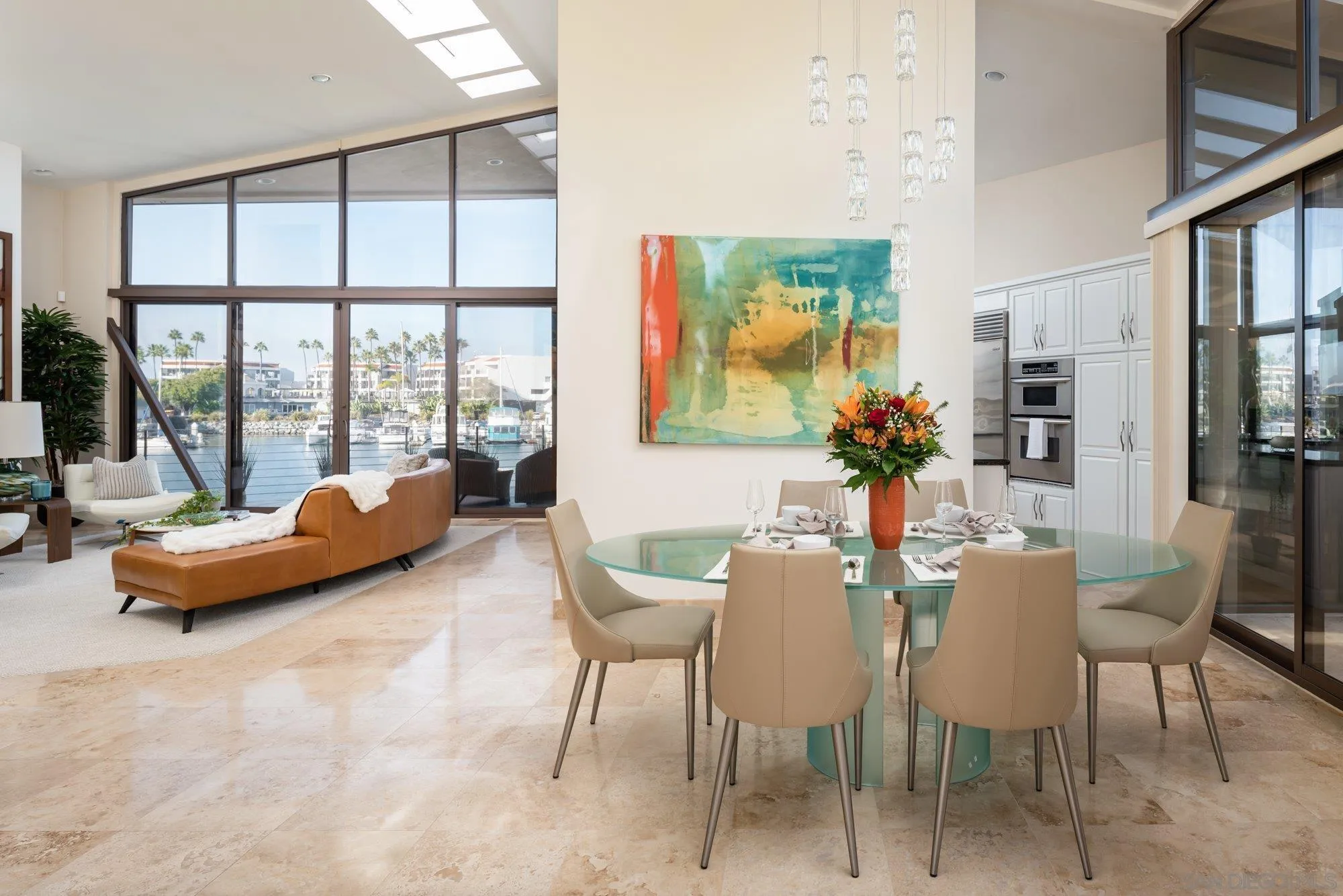 25 The Point Coronado, CA 92118 - Photo 7 of 52 a dining room with furniture and a floor to ceiling window