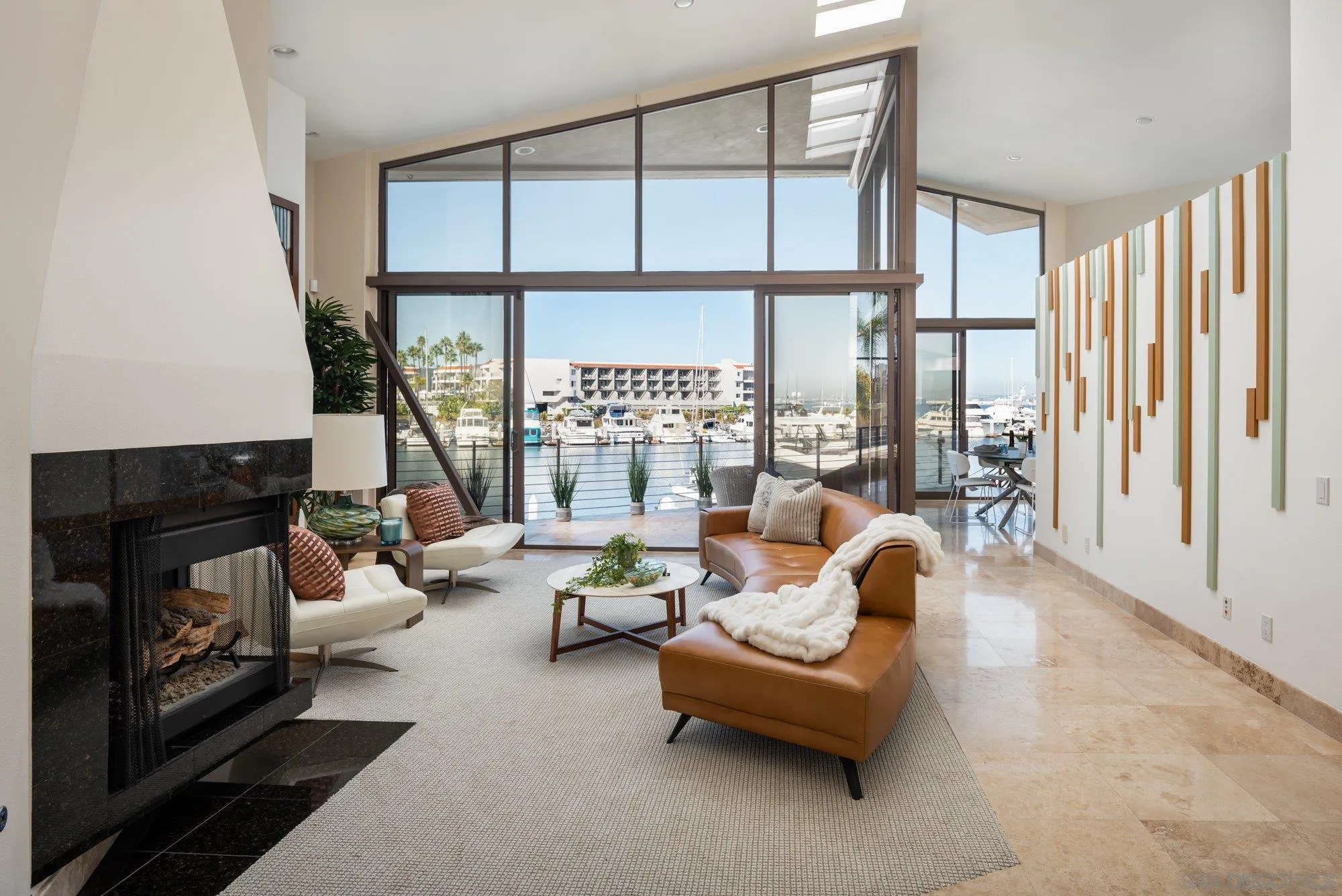 25 The Point Coronado, CA 92118 - Photo 10 of 52 a living room with furniture fireplace and a large window