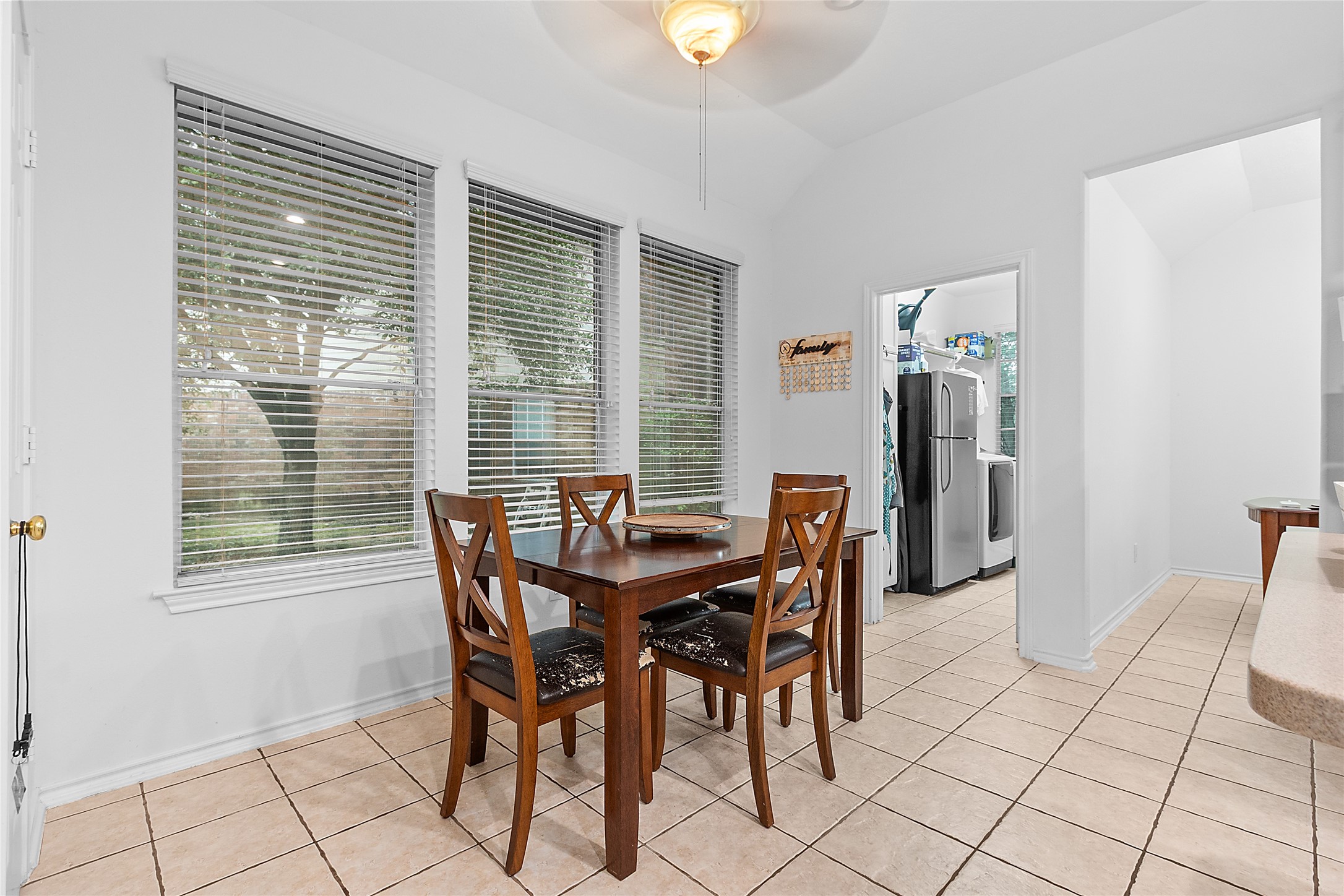 21014 Jessica Rose Lane Spring, TX 77379 - Photo 10 of 30 a view of a dining room with furniture and a window