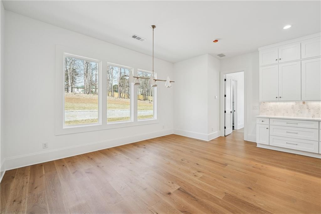 3315 Bold Springs Road Dacula, GA 30019 - Photo 16 of 63 a view of an empty room with window and cabinet