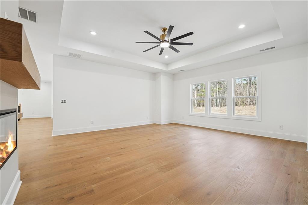 3315 Bold Springs Road Dacula, GA 30019 - Photo 25 of 63 a view of an empty room with window and wooden floor