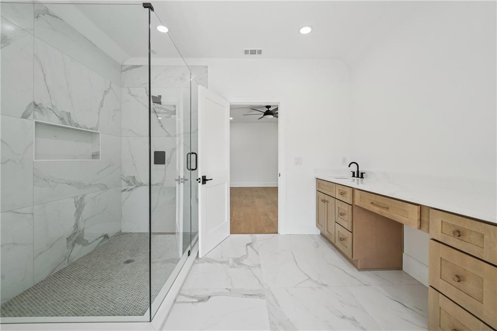 3315 Bold Springs Road Dacula, GA 30019 - Photo 29 of 63 a bathroom with a bathtub and a shower