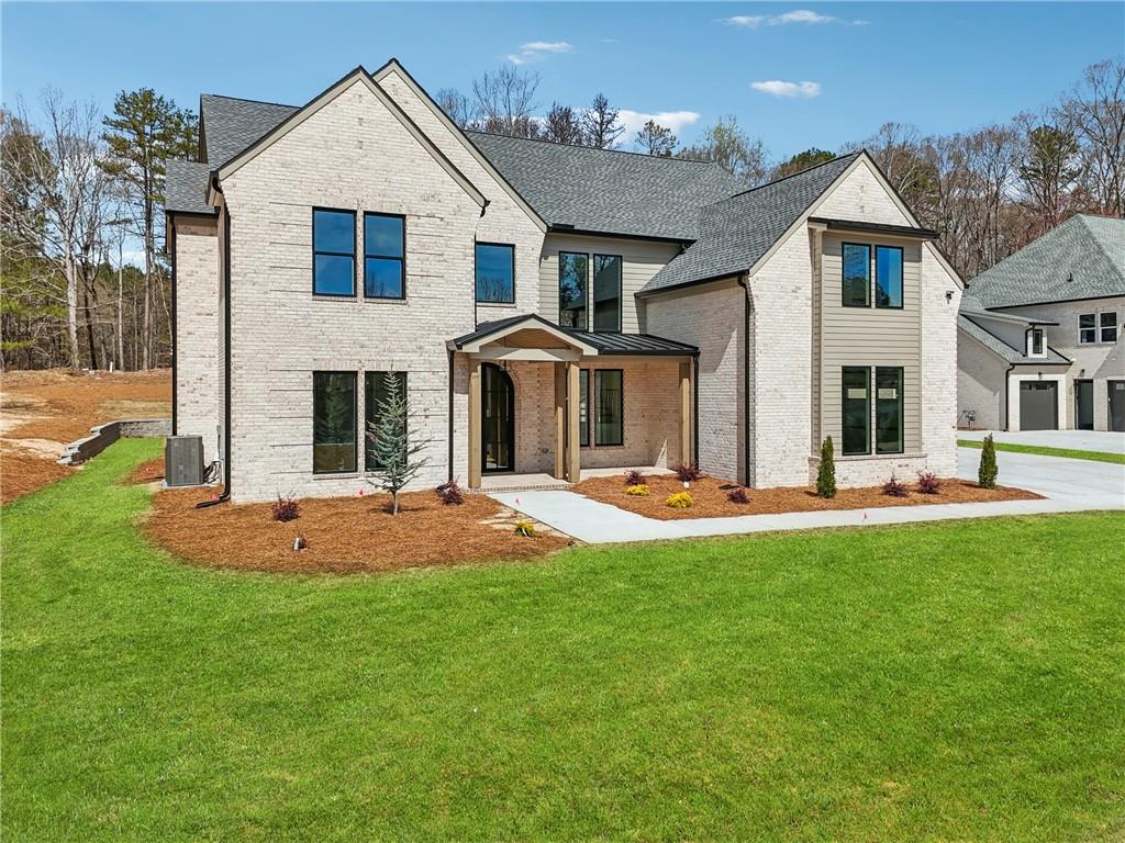 3315 Bold Springs Road Dacula, GA 30019 - Photo 3 of 63 a front view of a house with yard and green space
