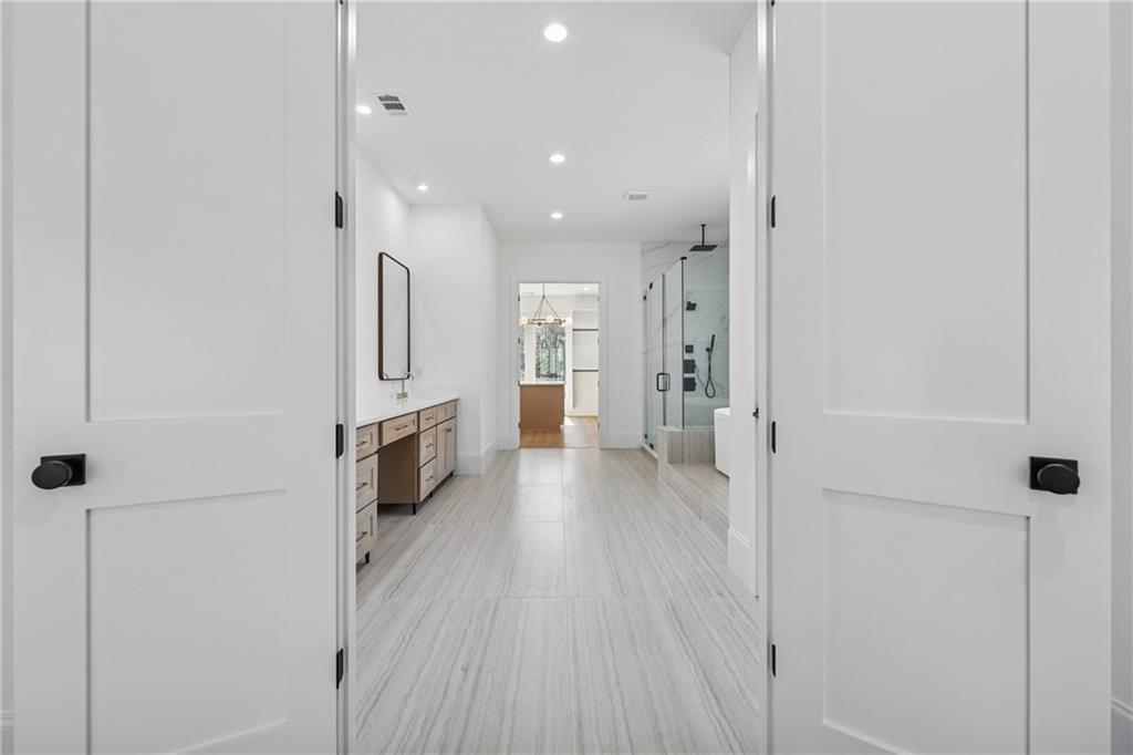 3315 Bold Springs Road Dacula, GA 30019 - Photo 42 of 63 a view of a kitchen with a refrigerator and a stove top oven