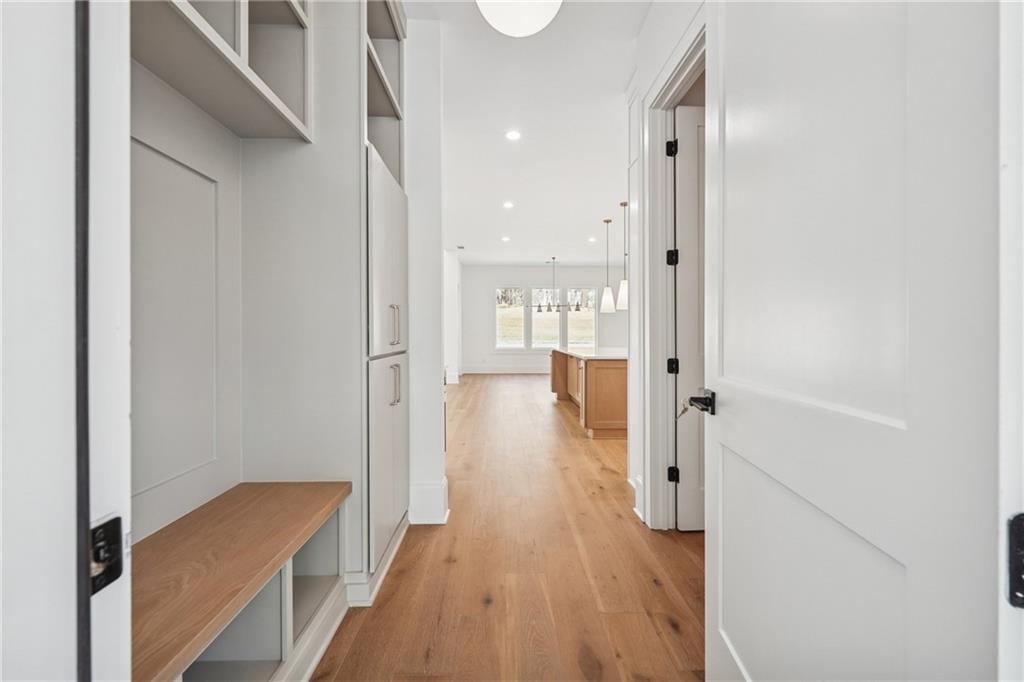 3315 Bold Springs Road Dacula, GA 30019 - Photo 54 of 63 a view of a hallway with wooden floor and a living room