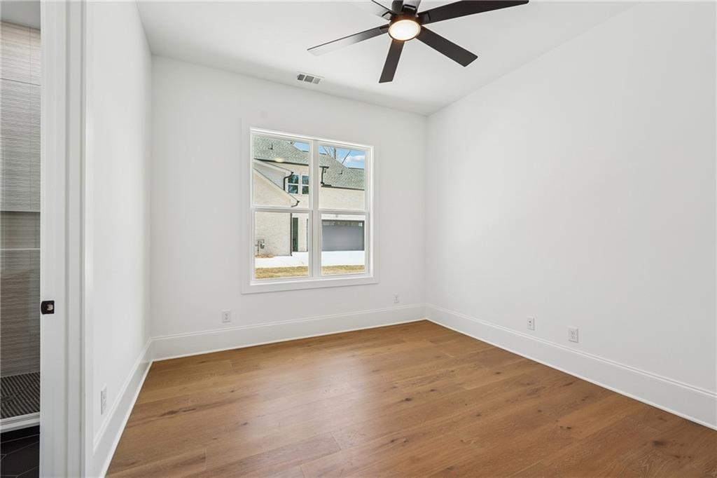 3315 Bold Springs Road Dacula, GA 30019 - Photo 56 of 63 an empty room with a window and a fan