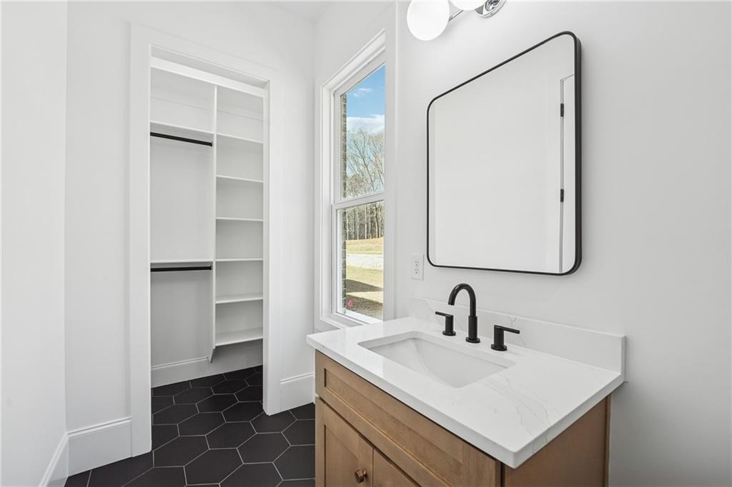 3315 Bold Springs Road Dacula, GA 30019 - Photo 59 of 63 a bathroom with a sink and a mirror
