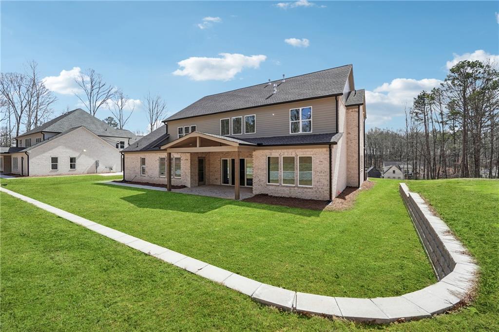 3315 Bold Springs Road Dacula, GA 30019 - Photo 63 of 63 a view of a house with a backyard porch and sitting area